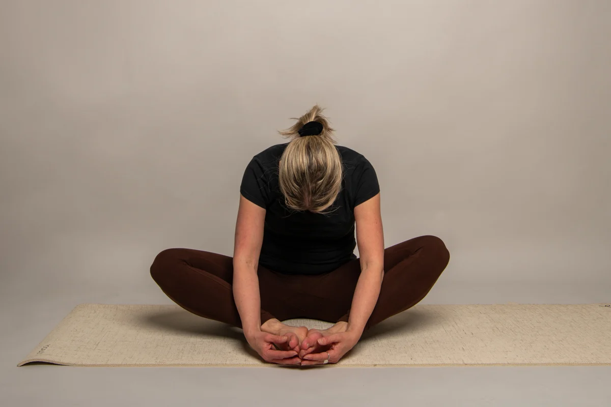 Yogapositionen Fjärilen